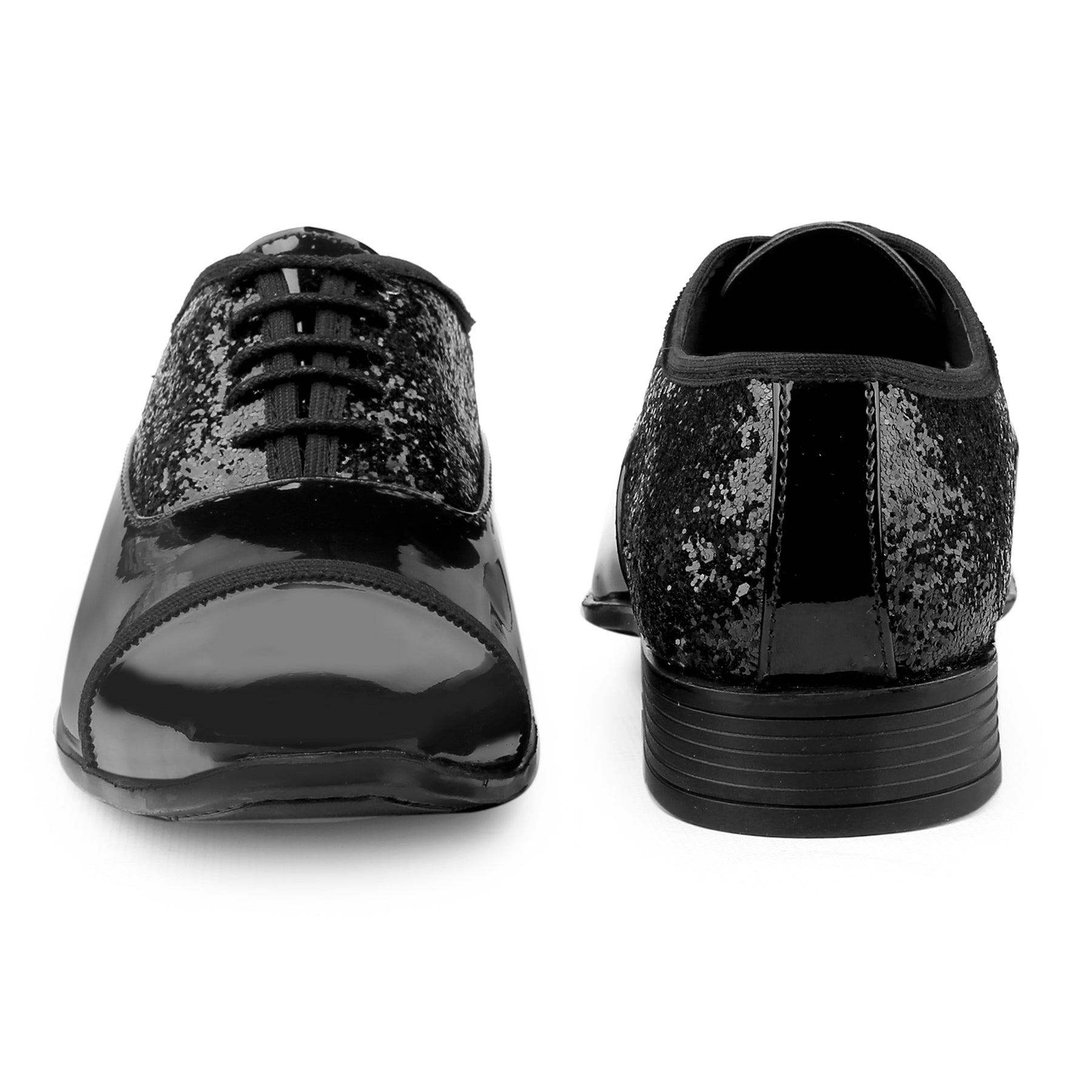 Black glittery shoes on a white background