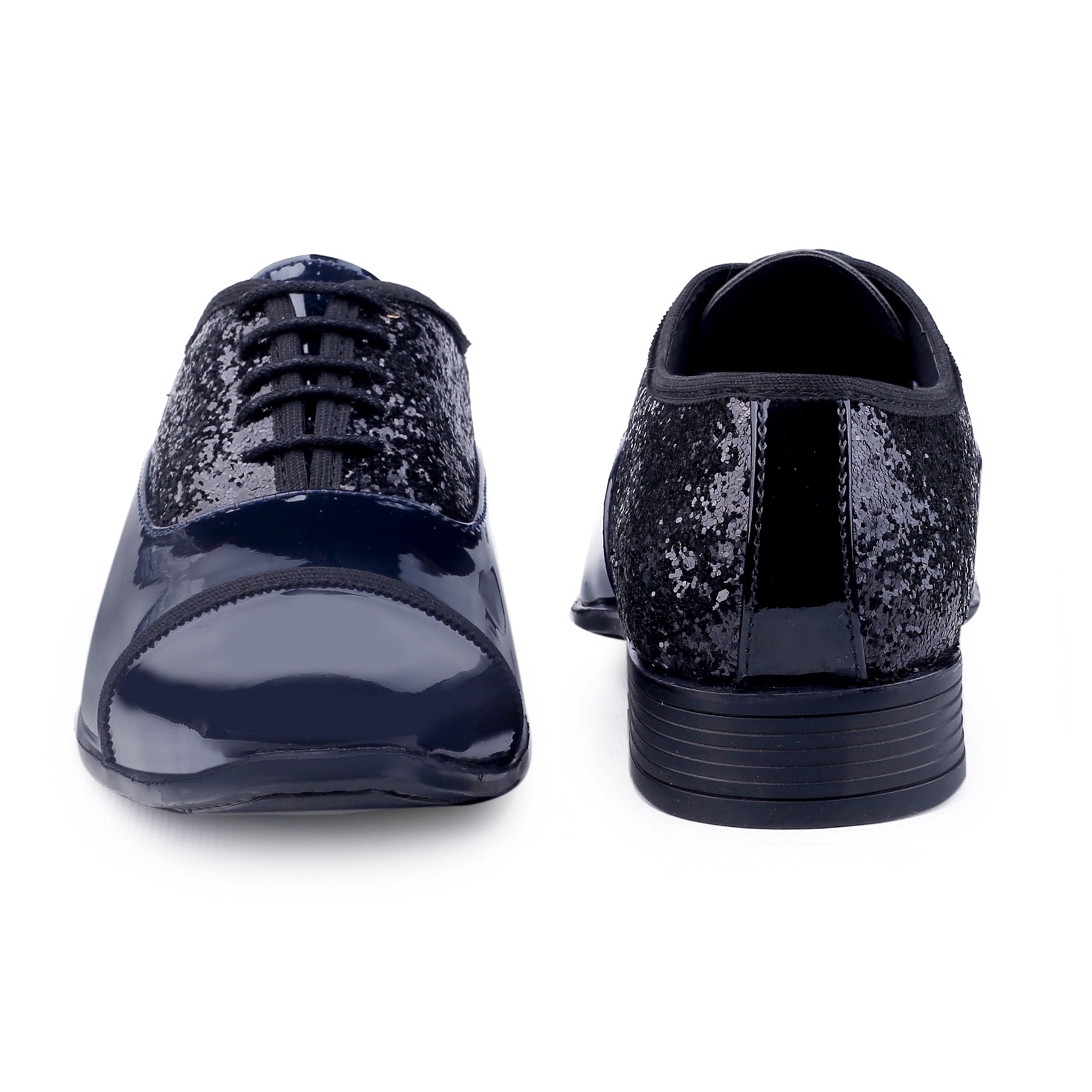 Black glittery shoes on a white background
